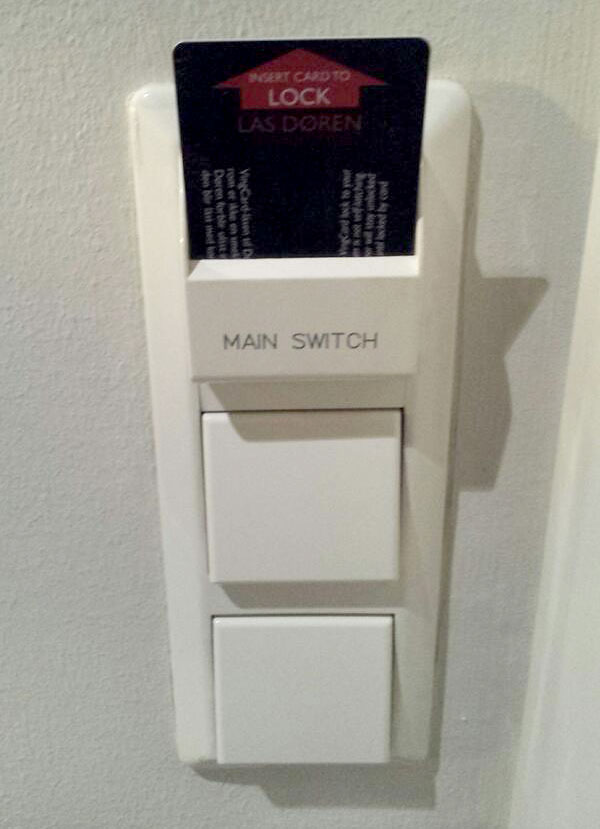 Light switches with a hotel room key card slot. Photo by @housecor.
